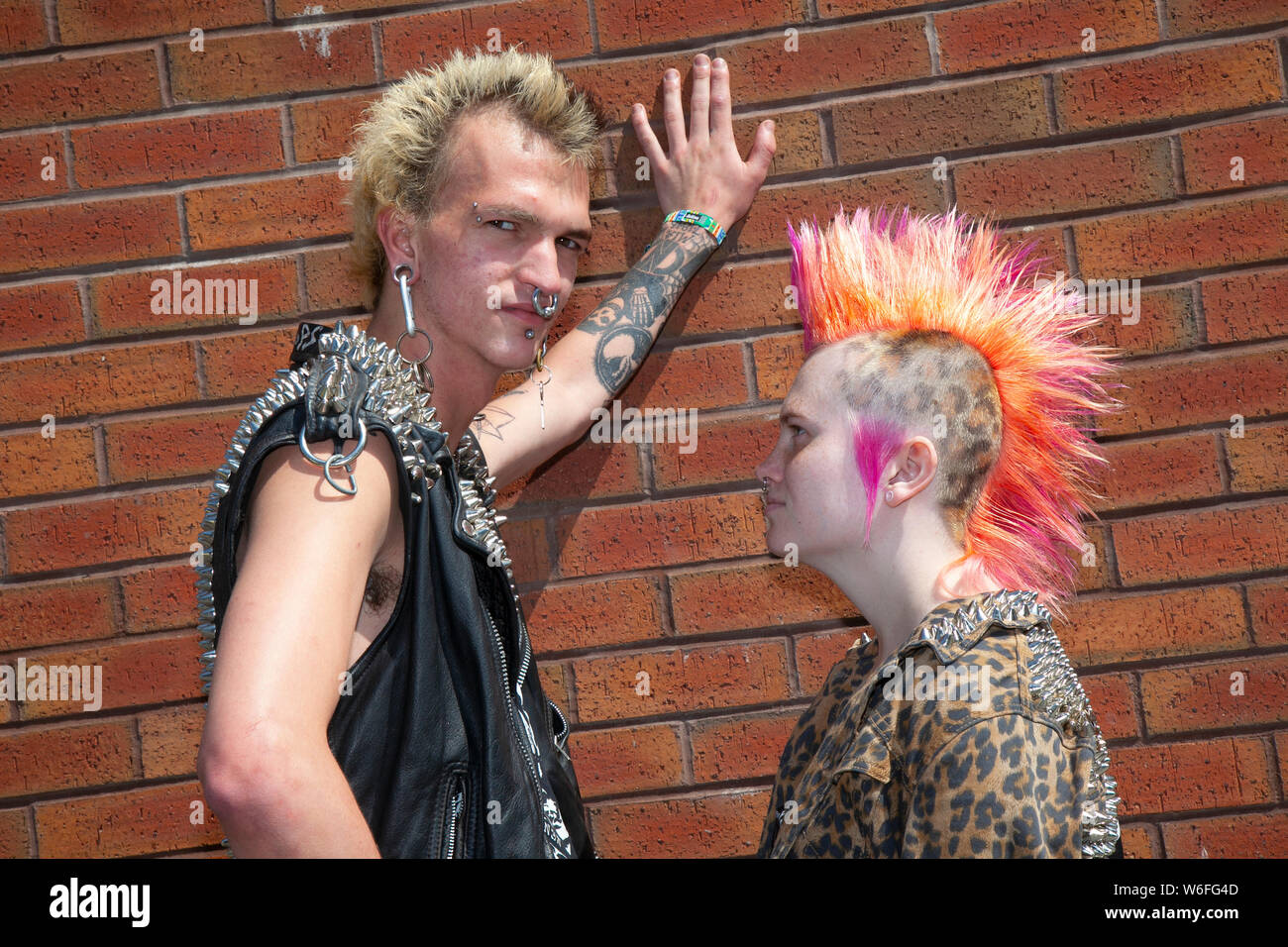 Blackpool, Lancashire, UK. 1st August,  2019. Beth Webster from Surrey & Saige Trammelle from the USA at the Rebellion Festival world's largest punk festival in Blackpool. At the beginning of August, Blackpool’s Winter Gardens plays host to a massive line up of punk bands for the 21st edition of Rebellion Festival attracting thousands of tourists to the resort.  Over 4 days every August in Blackpool, the very best in Punk gather for this social event of the year with 4 days of music across 6 stages with masses of bands. Credit; MediaWorldImages/Ģ����ý Live News Stock Photo