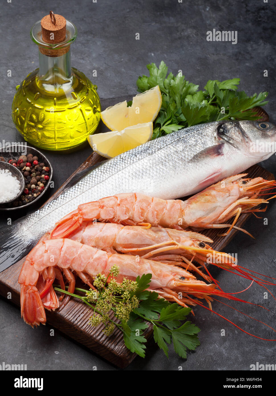 Fresh seafood. Trout fish and langostino shrimps with herbs and spices