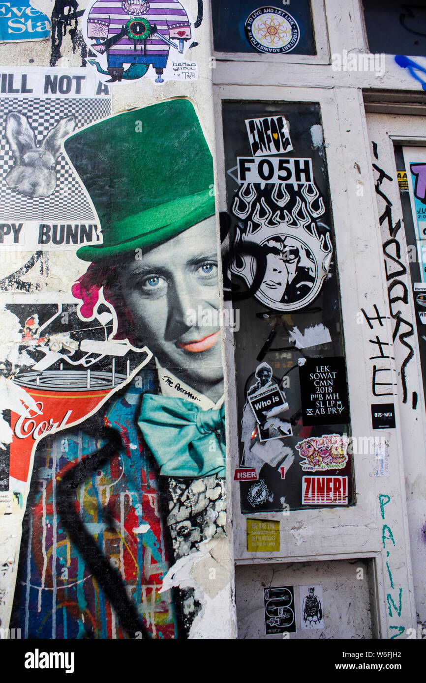 Walls with graffiti and posters in Brick Lane, London Stock Photo