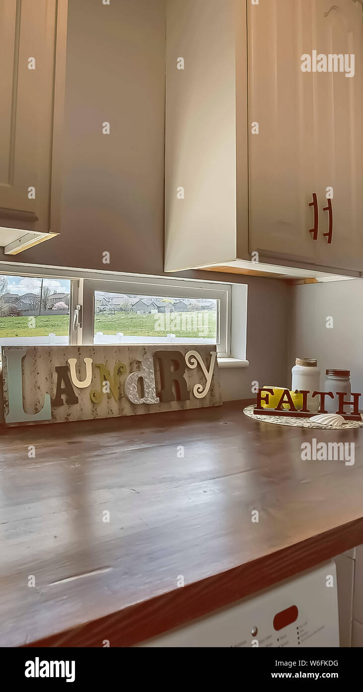 Vertical frame Laundry room interior with and window above the