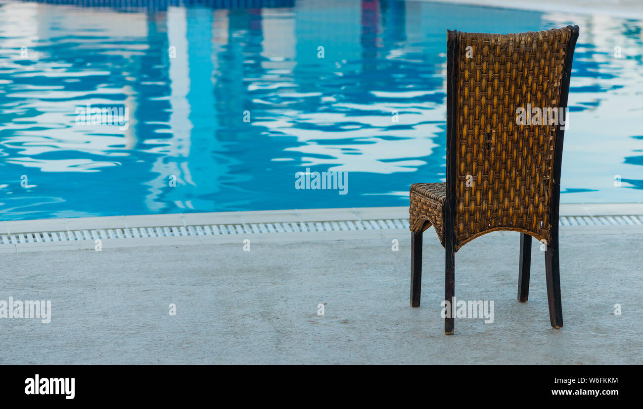 chair near pool at summer sunset Stock Photo Alamy