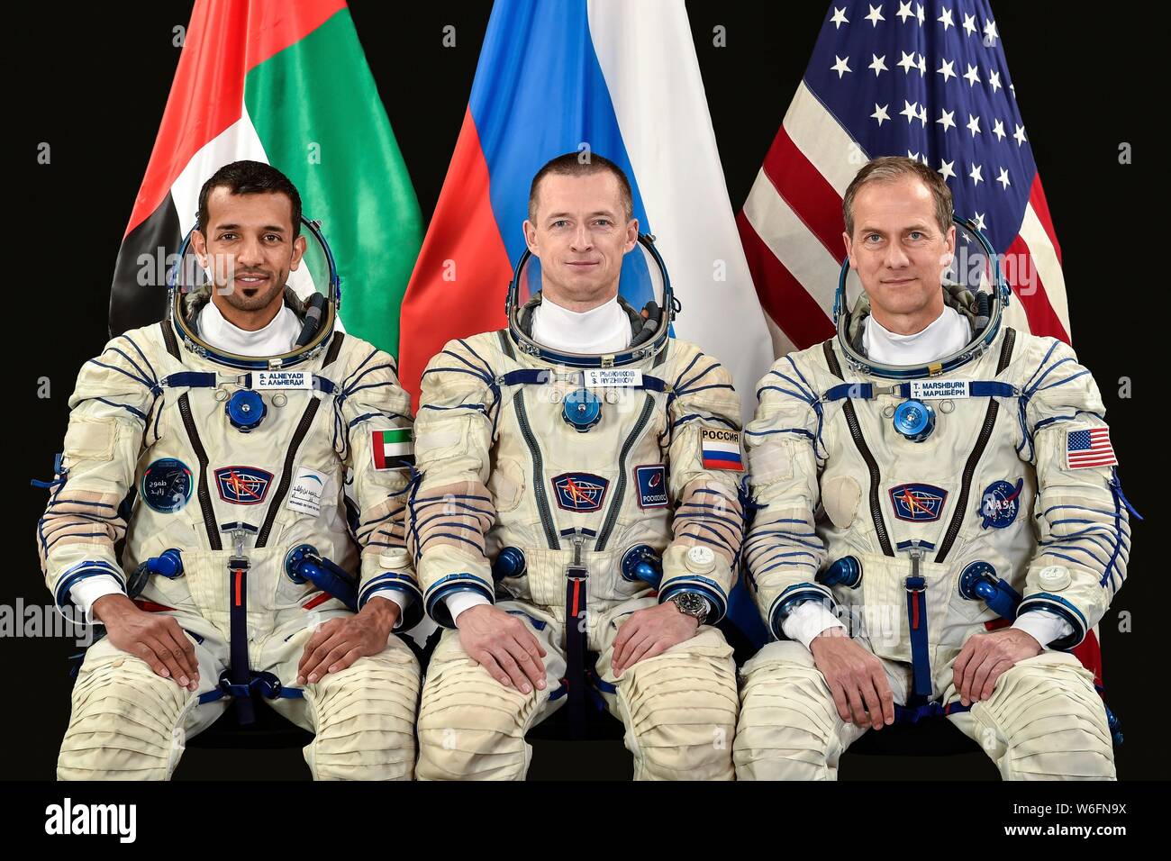 International Space Station Expedition 61-62 backup crew members Emirati participant Sultan al-Neyadi, left, Russian cosmonaut Sergey Ryzhikov and American astronaut Thomas Marshburn poses for a group portrait at the Gagarin Cosmonaut Training Center June 7, 2019 in Star City, Russia. Expedition 61-62 is expected to launch to the International Space Station on September 25, 2019. Stock Photo