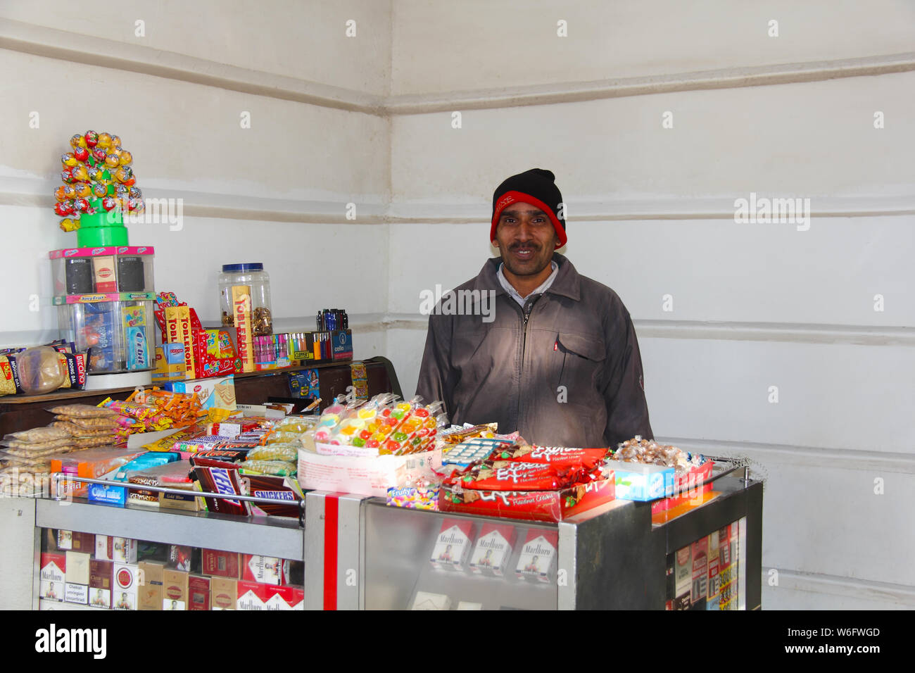 Shopkeeper in a shop Stock Photo
