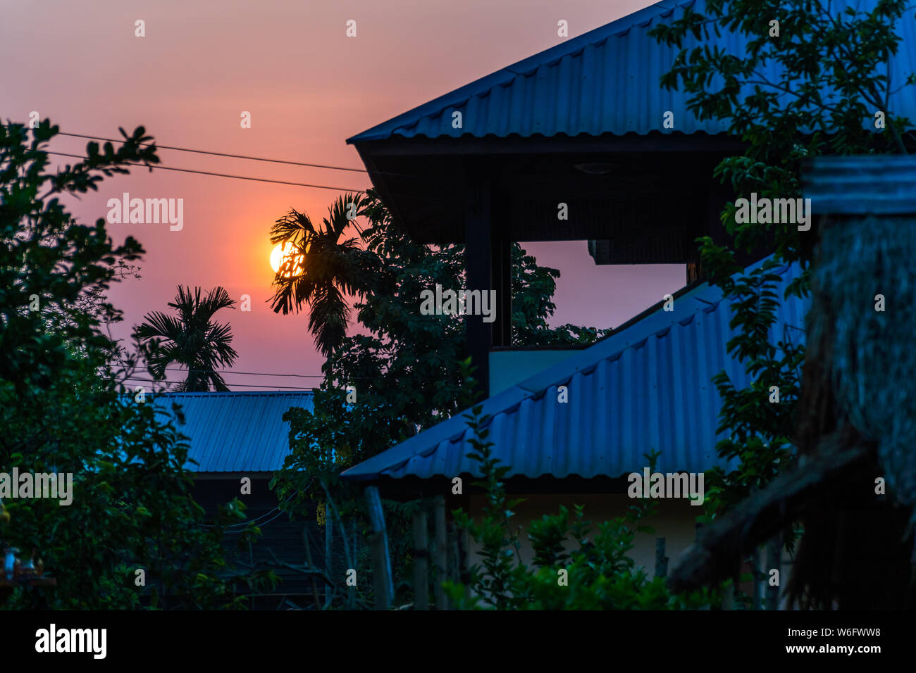 Dawn Sun raise up the roof level, thailand country Stock Photo