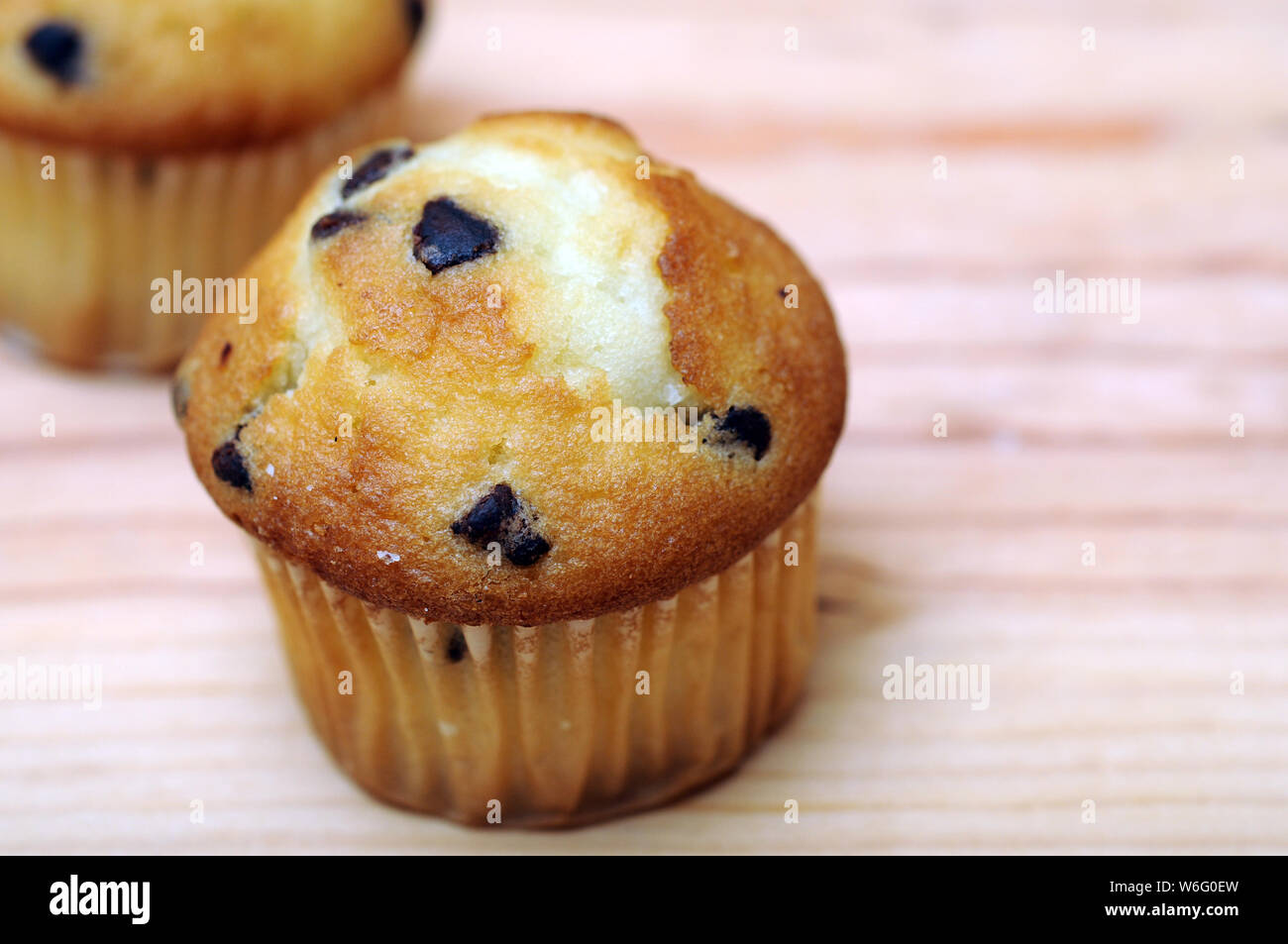 two small  muffins on table at market place Stock Photo