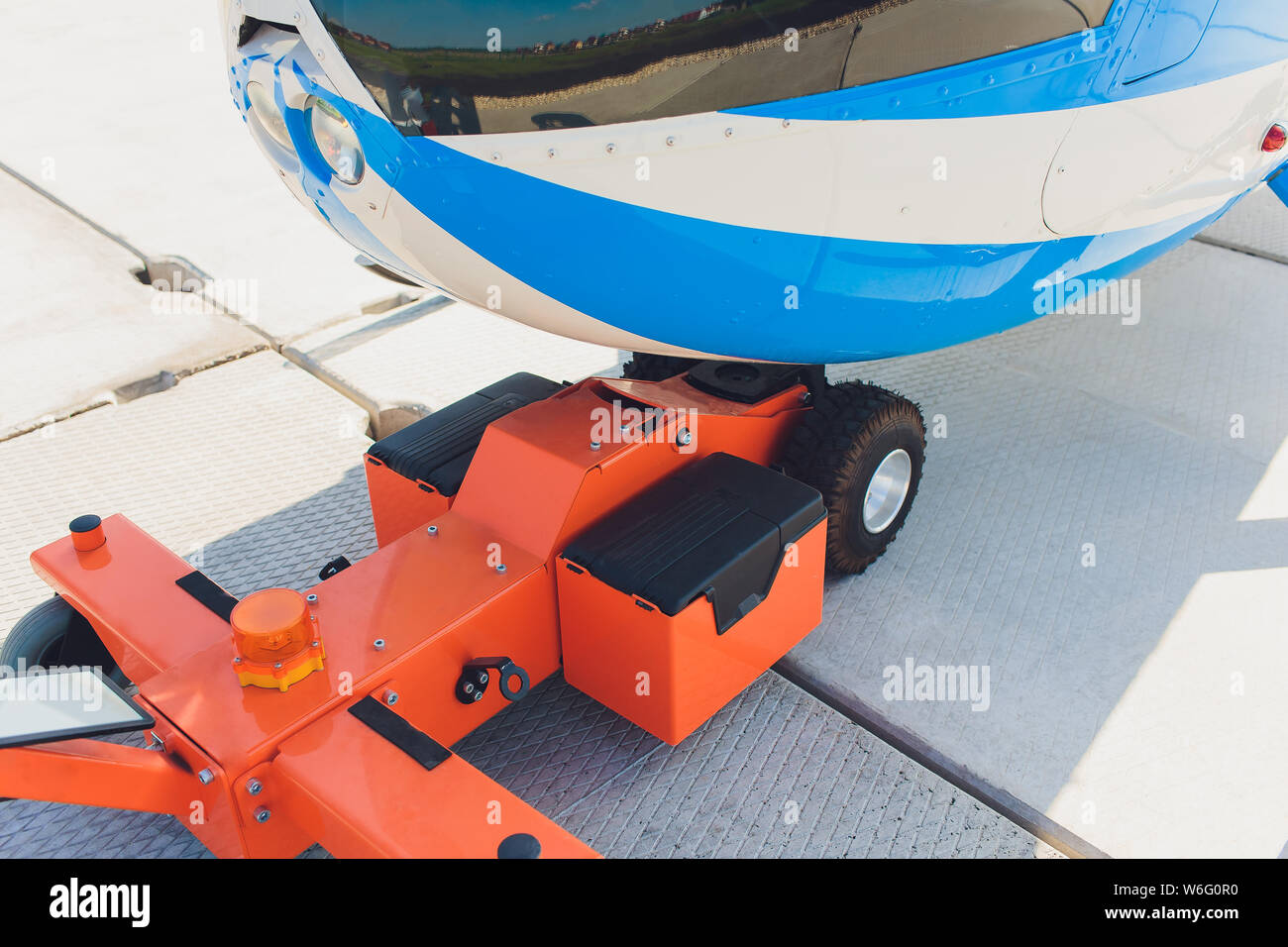 Tow bar for airplane in the airport Stock Photo Alamy