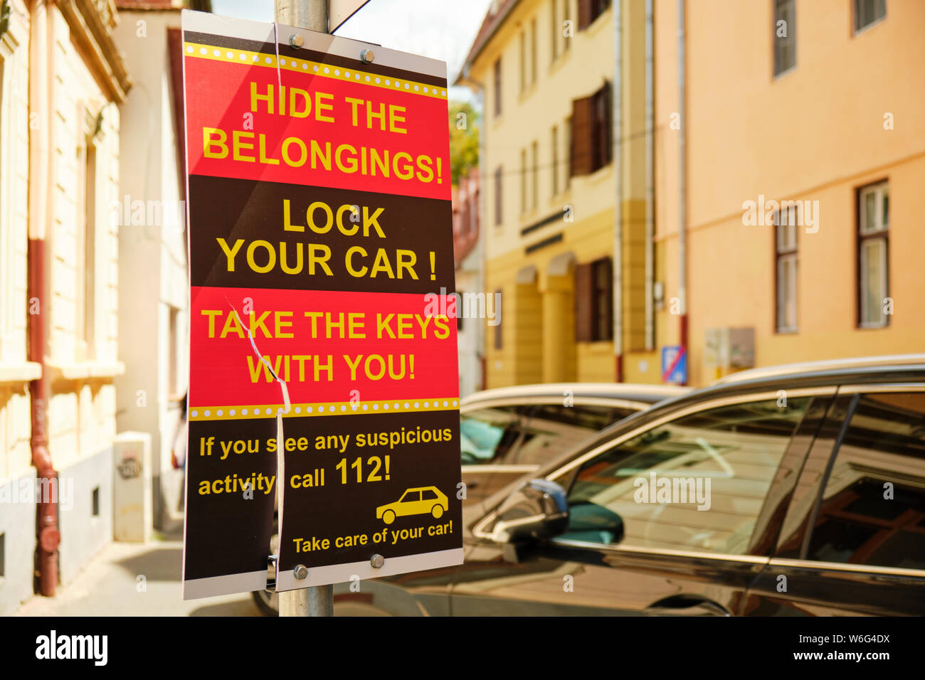 Sibiu, Romania - July 11, 2019: Warning sign for car drivers to protect their car and belongings against thieves. Copy-space on the right. Stock Photo