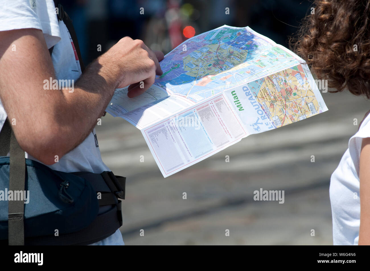 Italy, Lombardy, Milan, Young Couple Browsing a Map Stock Photo