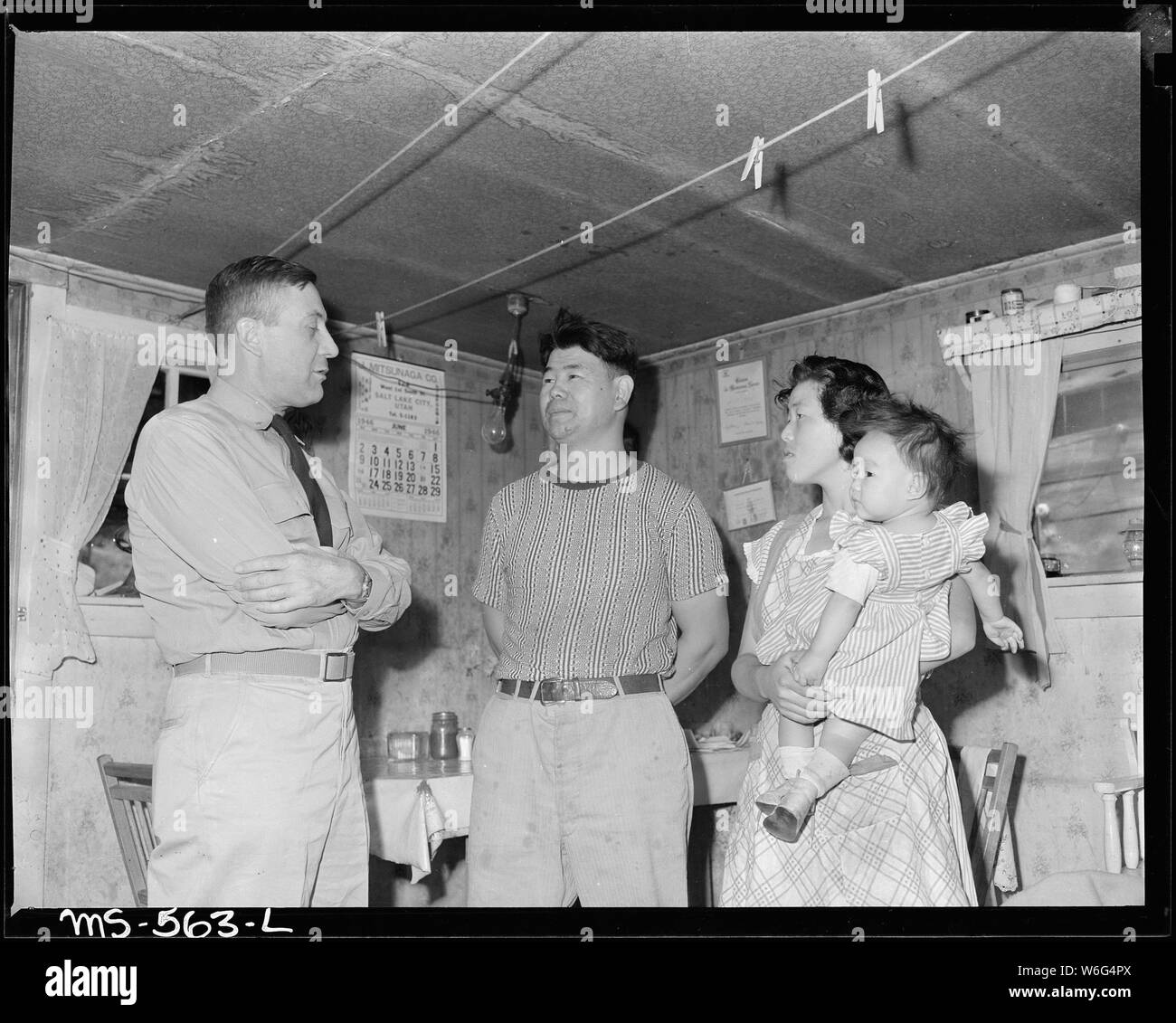 Commodore Charles T. Dikeman talks with F. Sugiyama, Sec-Treas of local UMWA and his wife. Hudson Coal Company, Hudson Mine, Sweet Mine, Carbon County, Utah. Stock Photo
