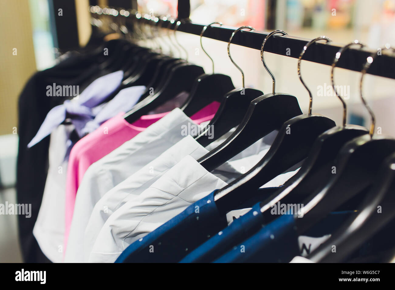 Wardrobe Rack With Stylish Clothes Shop Interior Stock Photo