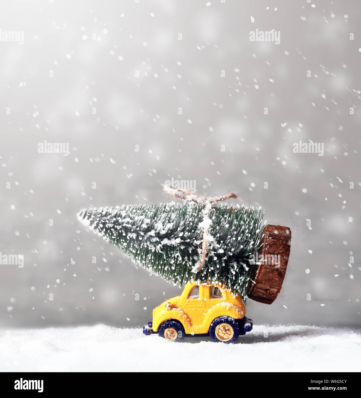 Christmas tree on toy car. Christmas holiday celebration concept. Stock Photo
