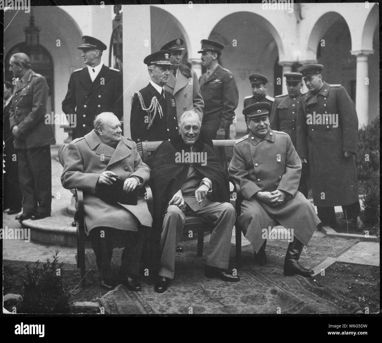Conference of the Big Three at Yalta makes final plans for the defeat of Germany. Here the Big Three sit on the patio together, Prime Minister Winston S. Churchill, President Franklin D. Roosevelt, and Premier Josef Stalin., 02/1945; General notes:  Use War and Conflict Number 750 when ordering a reproduction or requesting information about this image. Stock Photo