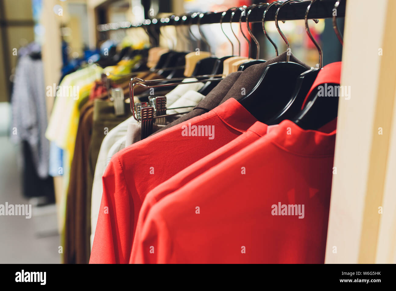 Wardrobe Rack With Stylish Clothes Shop Interior Stock Photo