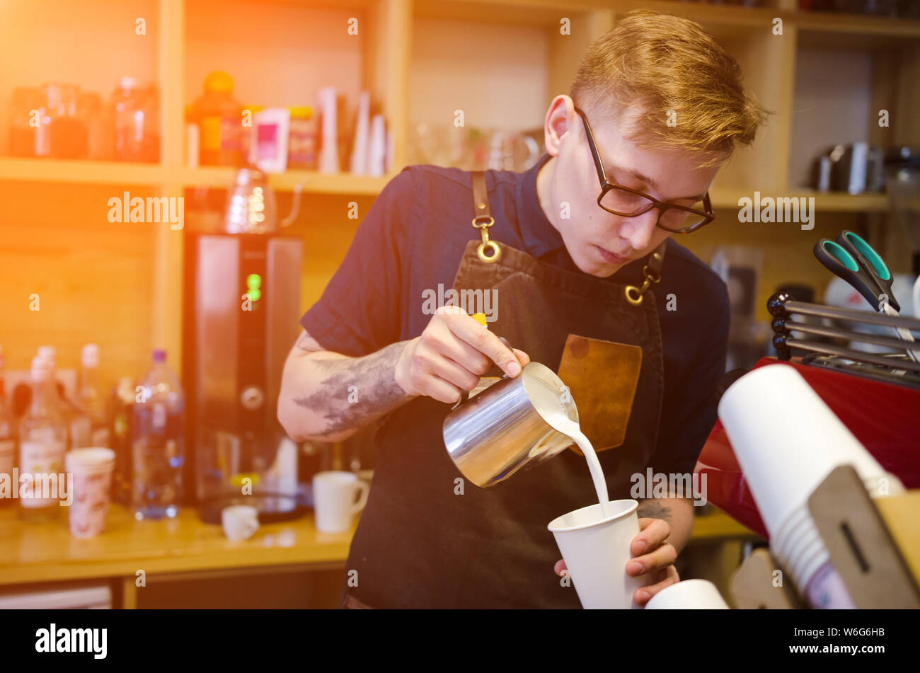 Barista making coffee latte art with coffee machine. Service concept
