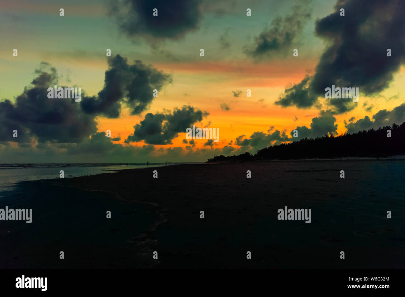 sunset on a beach Stock Photo - Alamy