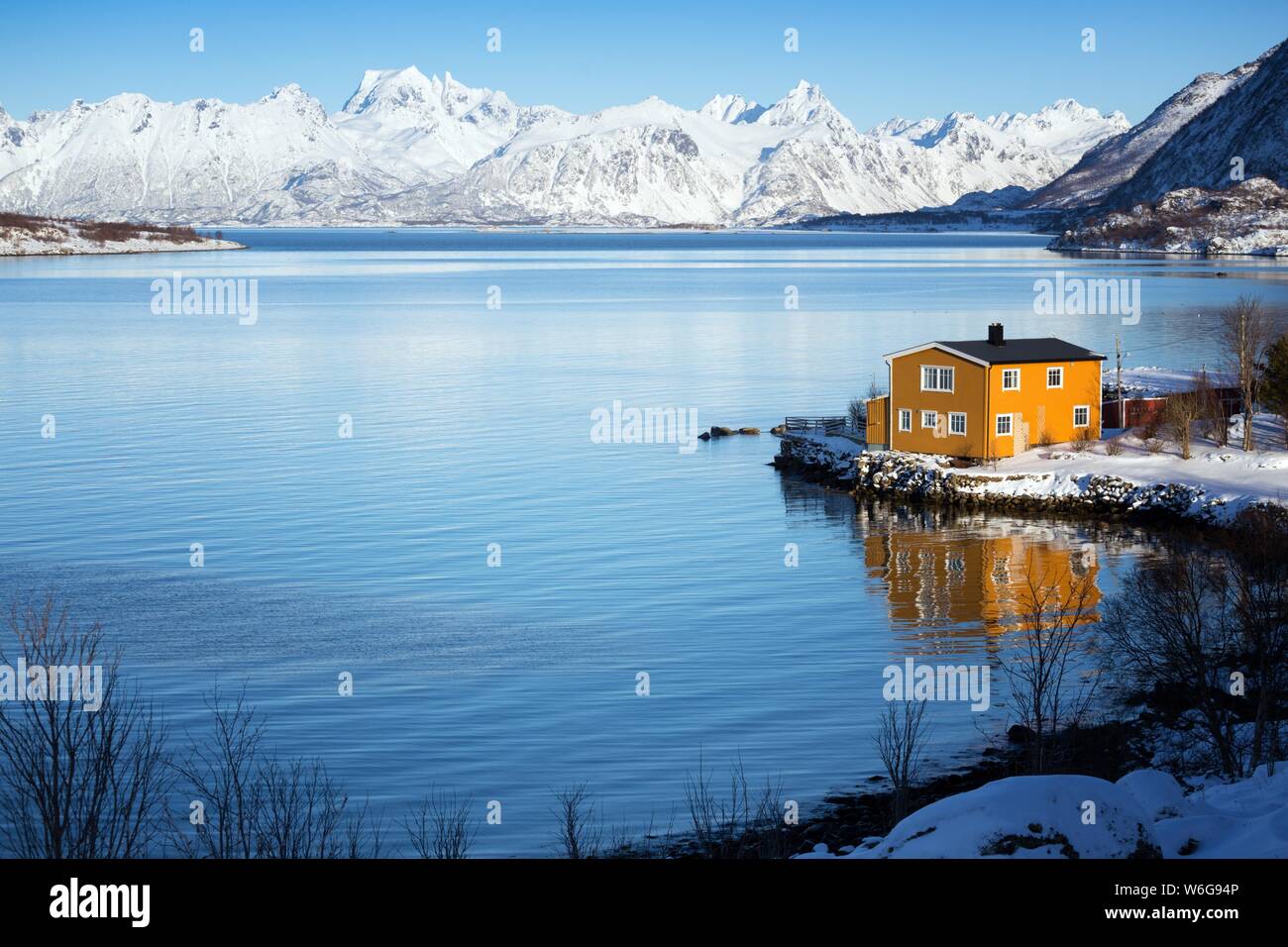 traditional norwegian wooden house to stand at the lakeside and