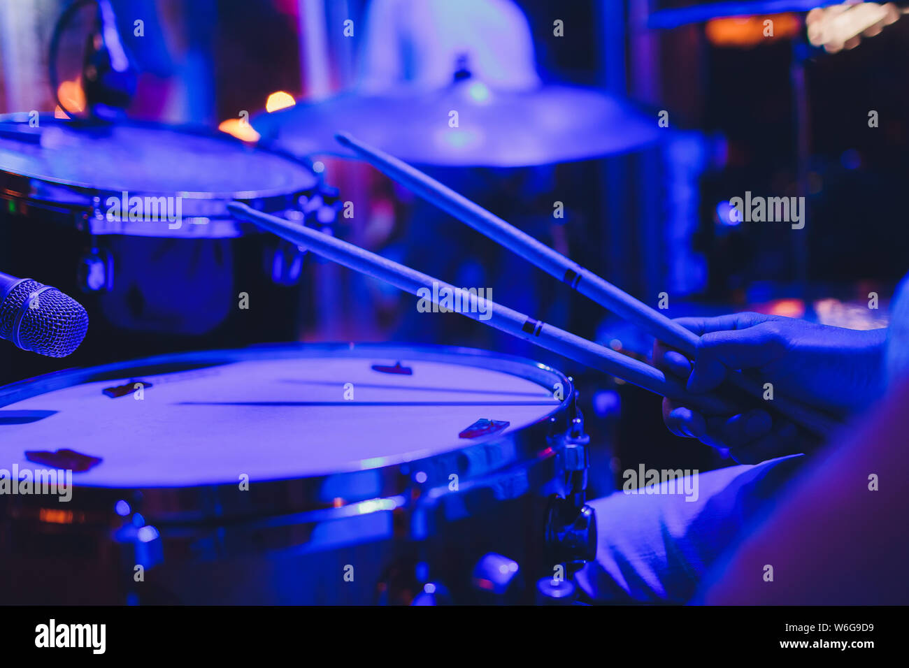 Drum kit on stage in the spotlight color. Stock Photo
