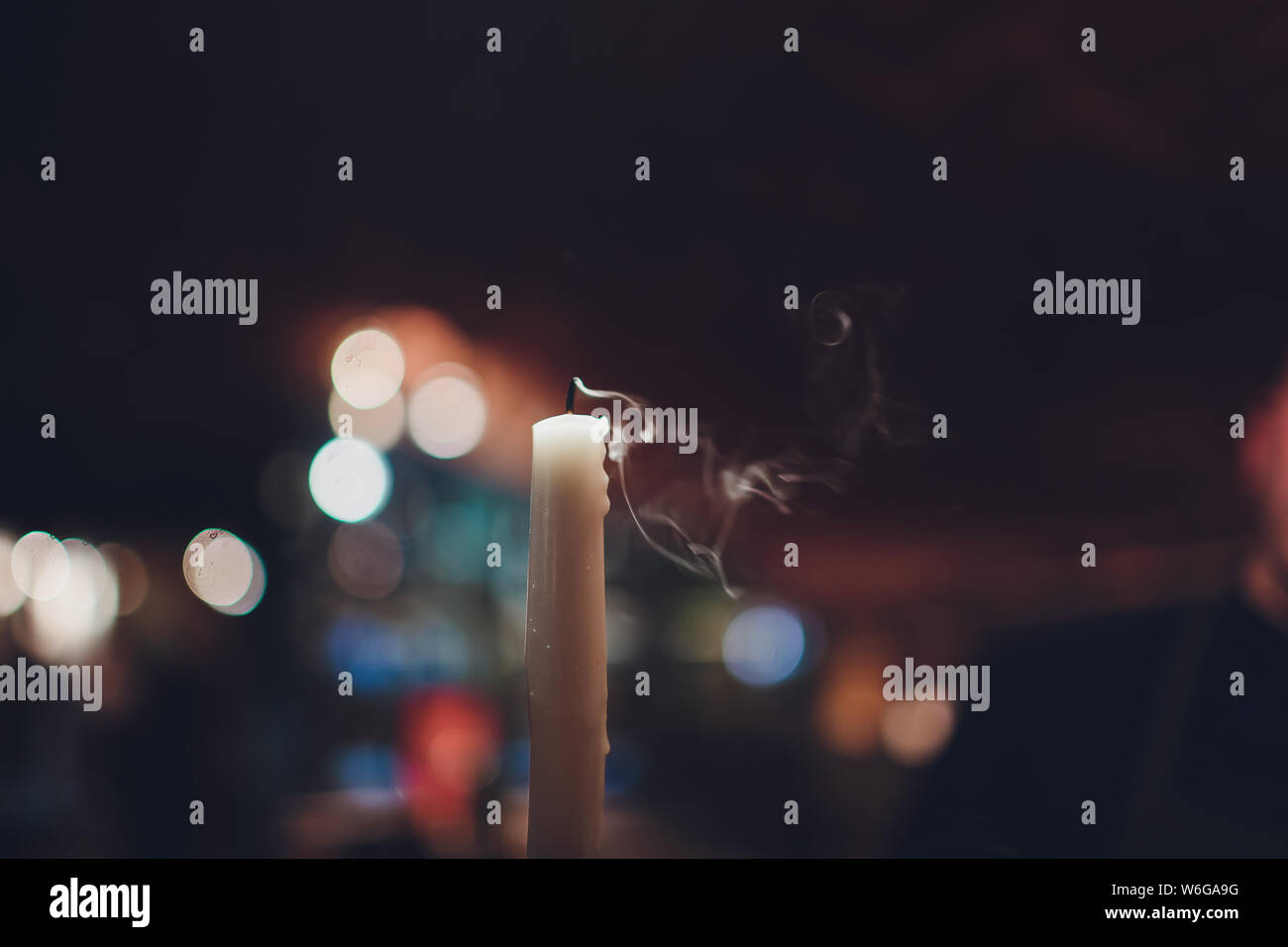 Candles Burning at Night. White Candles Burning in the Dark with focus