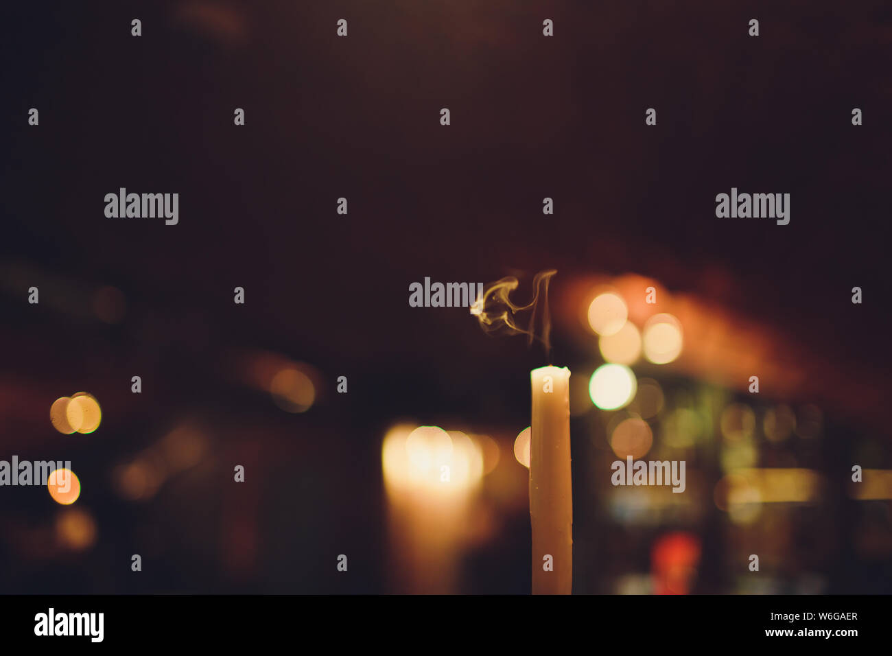 Candles Burning at Night. White Candles Burning in the Dark with focus