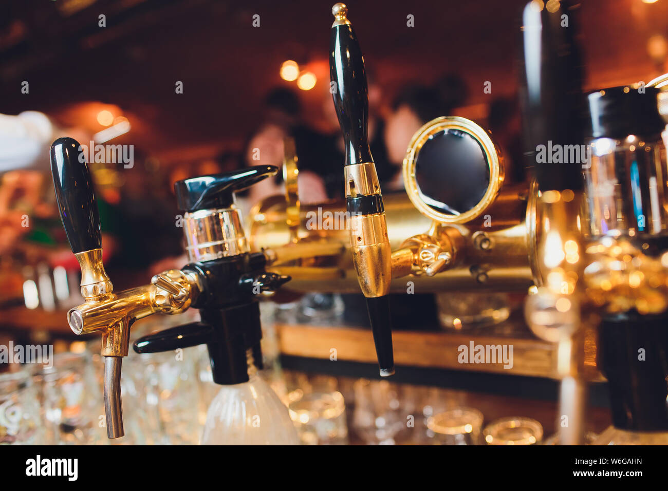 The beer taps in a pub. nobody. Selective focus. Alcohol concept