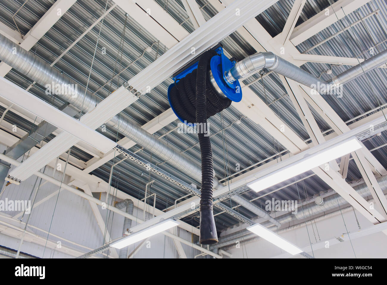 The device for removing exhaust gases in the car repair shop. Car