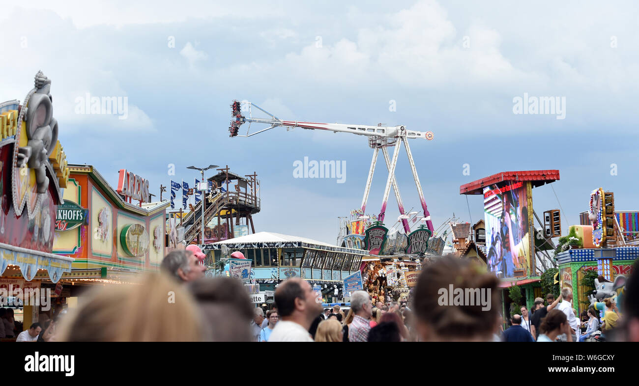 Herne, Germany. 01st Aug, 2019. Visitors go through the Cranger fair. Today the 535 Cranger Kirmes was opened and runs until 11 August. Credit: Caroline Seidel/dpa/Alamy Live News Stock Photo