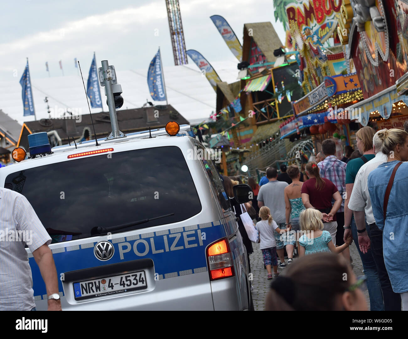 Herne, Germany. 01st Aug, 2019. The police are driving over the Cranger fair. Today the 535 Cranger Kirmes was opened and runs until 11 August. Credit: Caroline Seidel/dpa/Alamy Live News Stock Photo