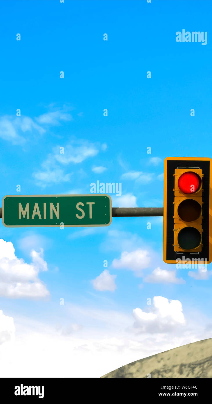 Vertical frame Main street sign between traffic lights mounted on a