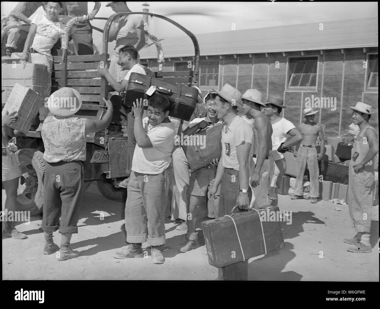 Eden, Idaho. Baggage, belonging to evacuees from the assembly center at Puyallup, Washington, is so . . .; Scope and content:  The full caption for this photograph reads: Eden, Idaho. Baggage, belonging to evacuees from the assembly center at Puyallup, Washington, is sorted and trucked to owners in their barrack apartments. Stock Photo