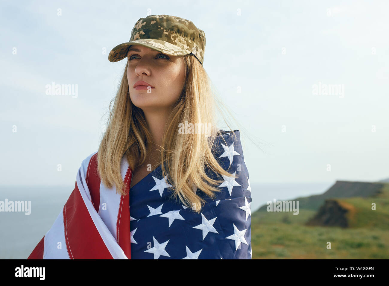 civilian woman in her husband's military cap. A widow with a flag of