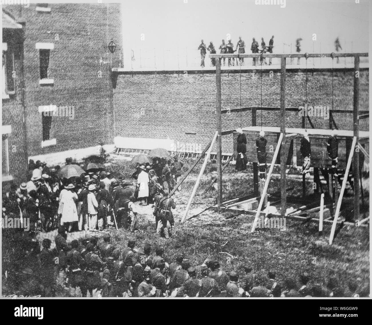 Execution of the four persons condemned as conspirators, Mary Surratt, Lewis Powell, David Herold, and George Atzerodt., 07/07/1865; General notes:  Use War and Conflict Number 264 when ordering a reproduction or requesting information about this image. Stock Photo