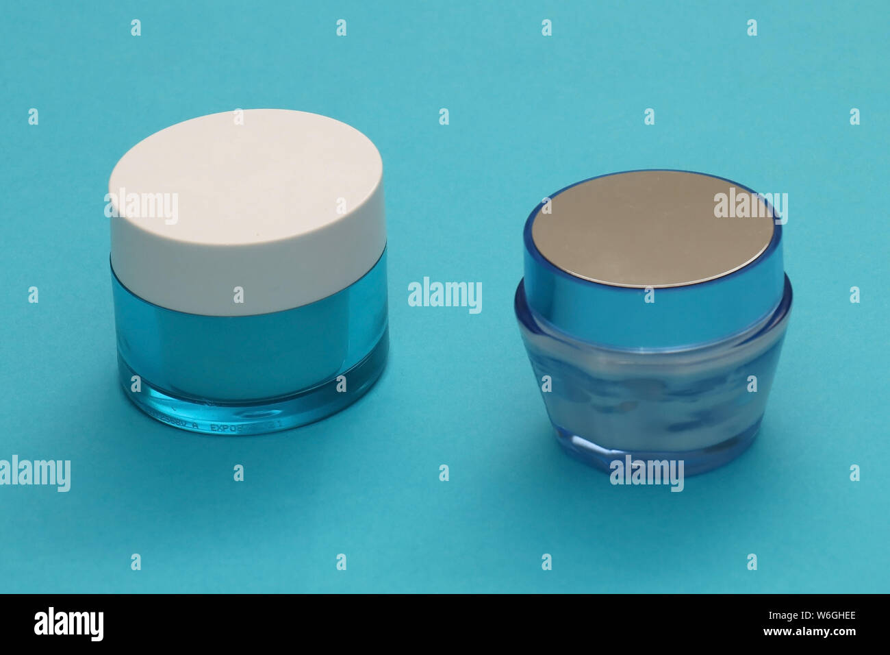 Face creams inside closed blue glass jars Stock Photo Alamy