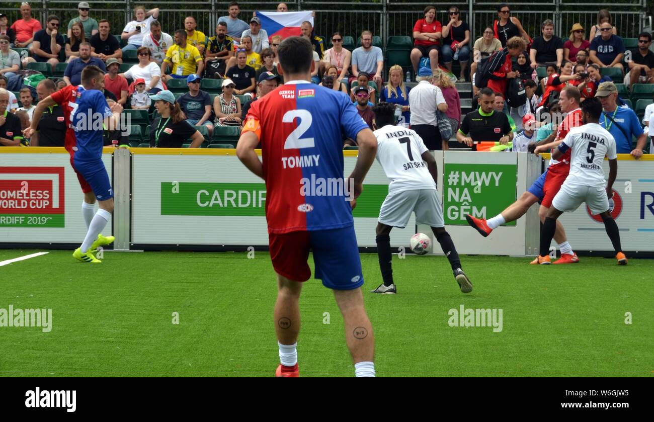 Players from India and the Czech republic compete for the ball at the Homeless football world cup in Cardiff in 2019. Stock Photo