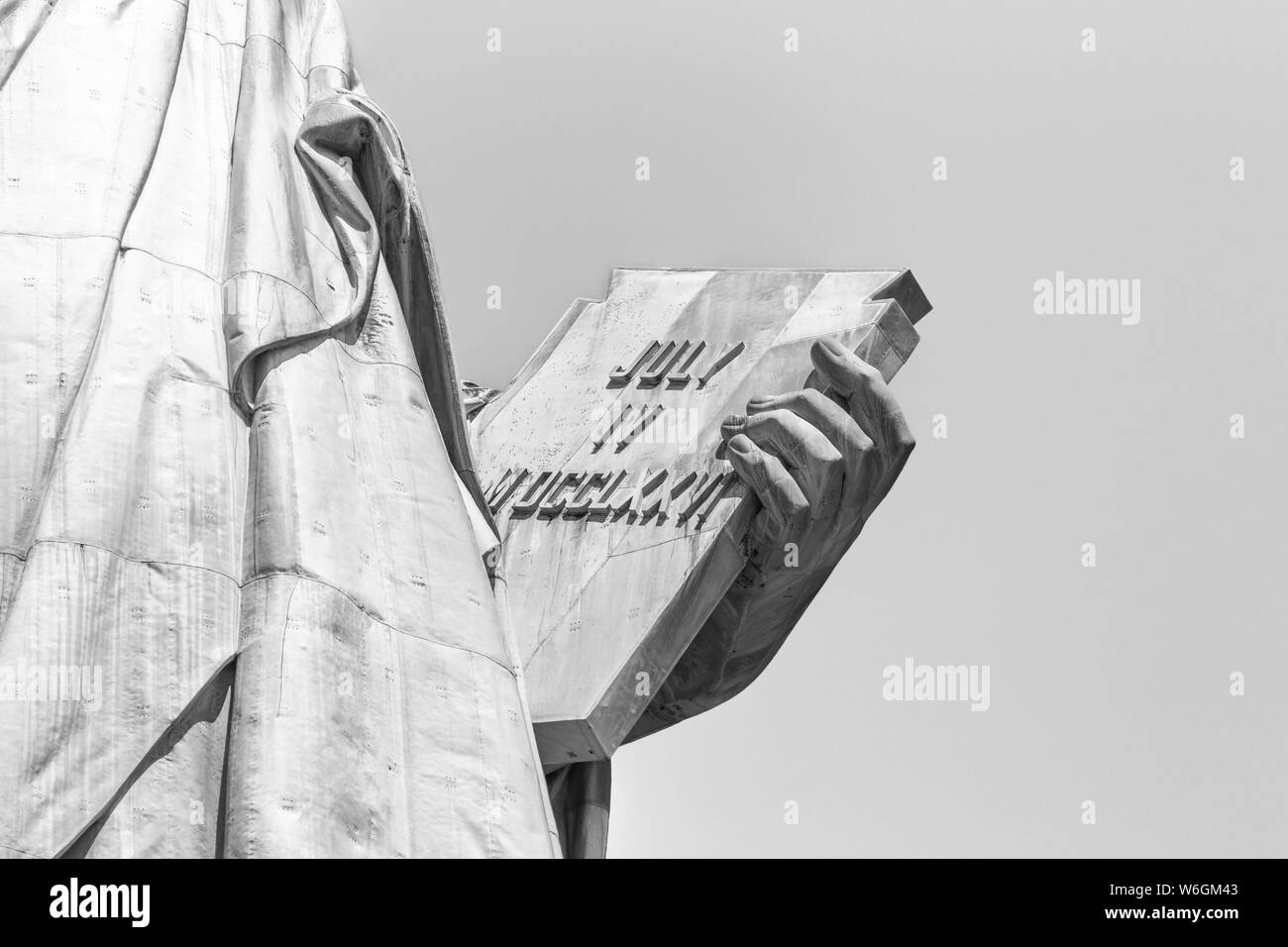 Statue of Liberty, left hand carries tabula ansata inscribed in Roman