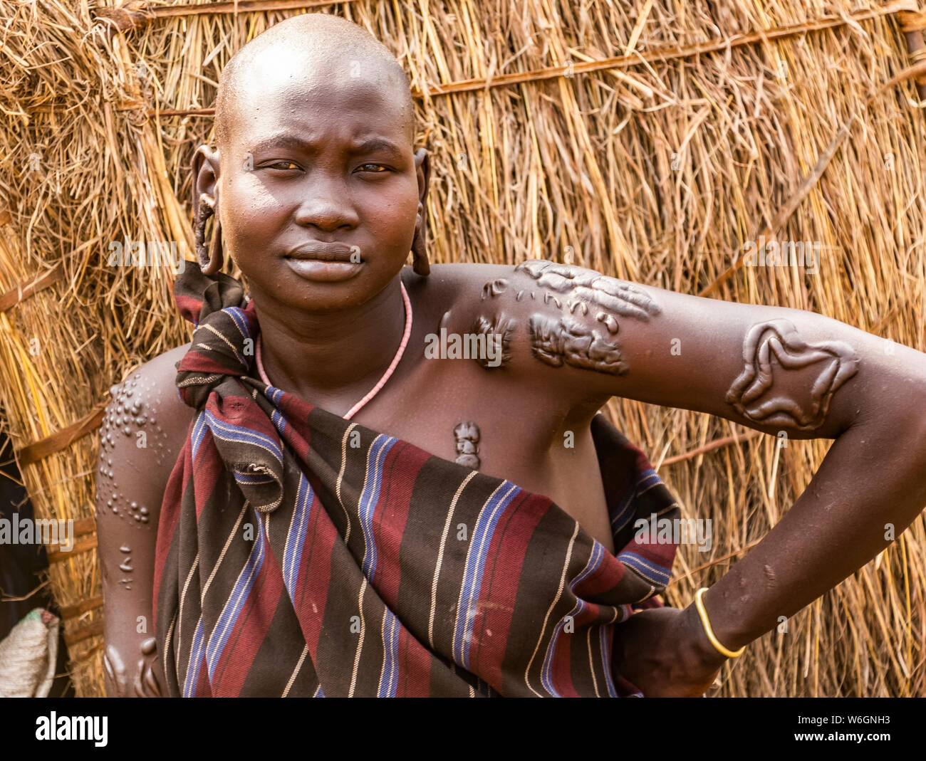 Mursi woman  in a village in Mago National Park, Omo Valley; Southern Nations Nationalities and Peoples' Region, Ethiopia Stock Photo