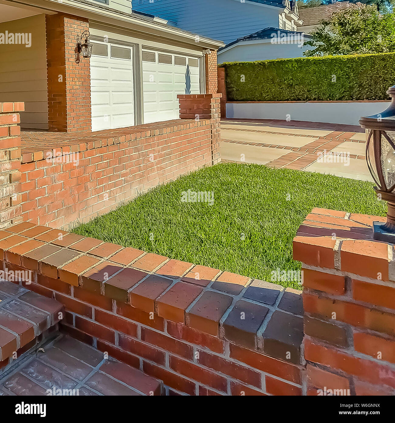 Frame Facade Of A House With A Patio And Outdoor Stairs Paved With
