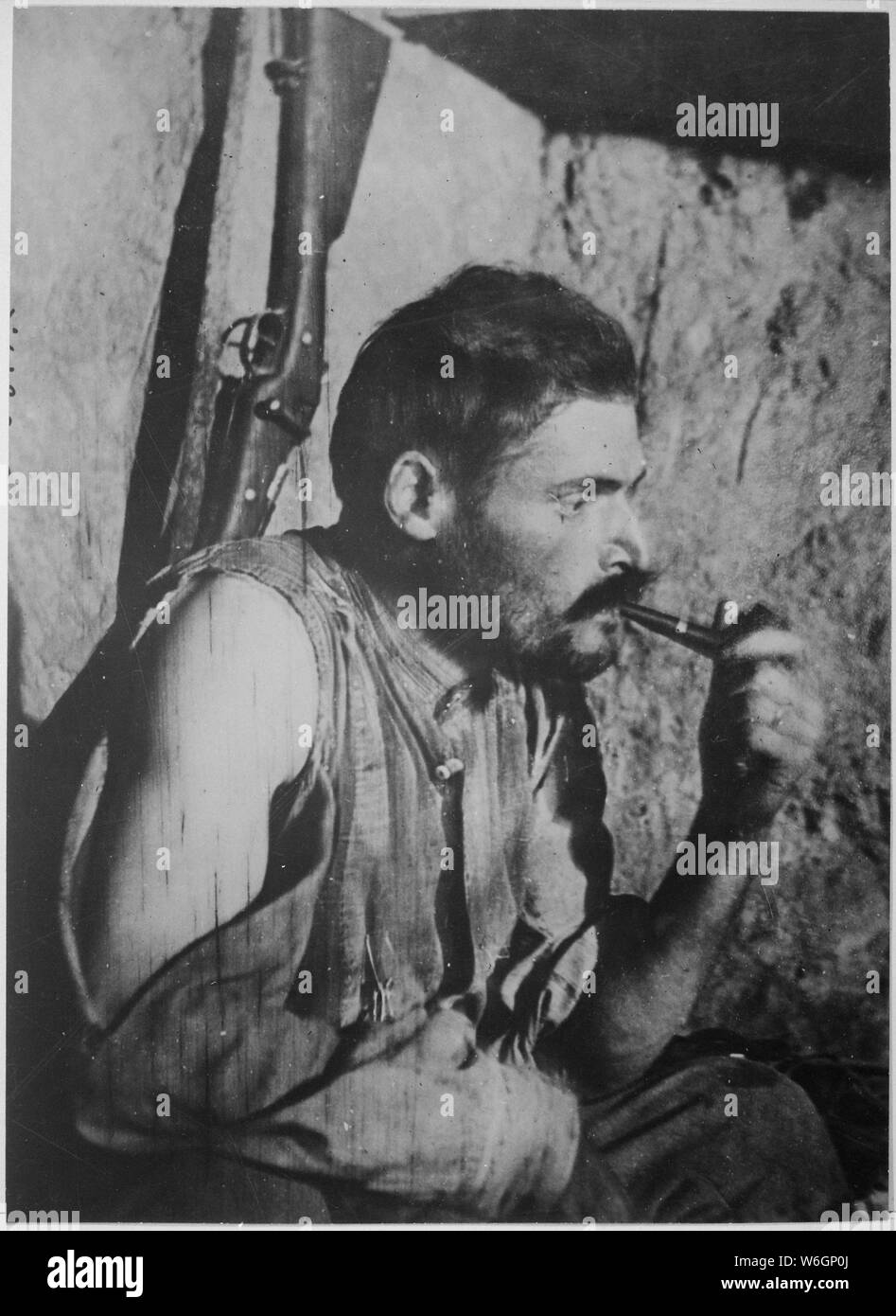 French soldier resting after battle. Underwood and Underwood., 1917 - 1919; General notes:  Use War and Conflict Number 646 when ordering a reproduction or requesting information about this image. Stock Photo