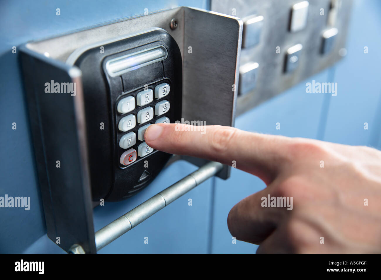 Close-up Of A Person 's Finger Pressing Entering Floor Code Inside Elevator Stock Photo