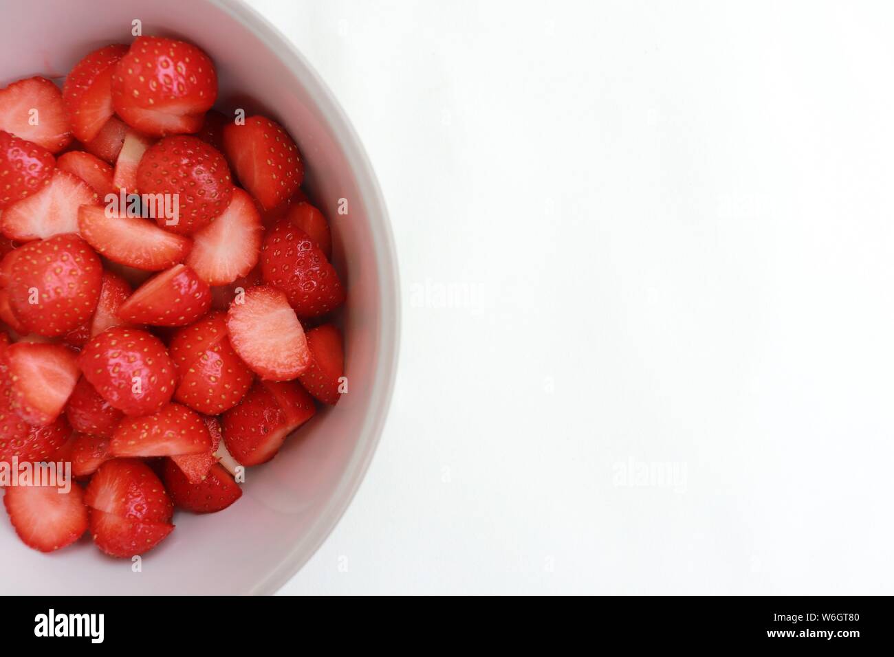Close up of strawberries on white background Stock Photo - Alamy