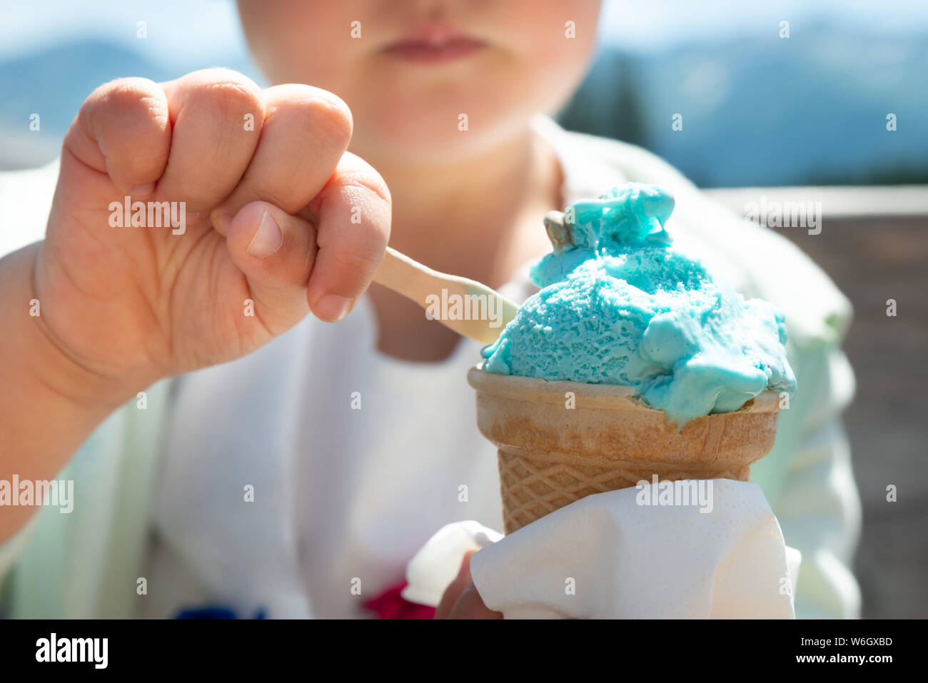 Little Girl Eating Ice Cream In Summer On A Hot Day Stock Photo