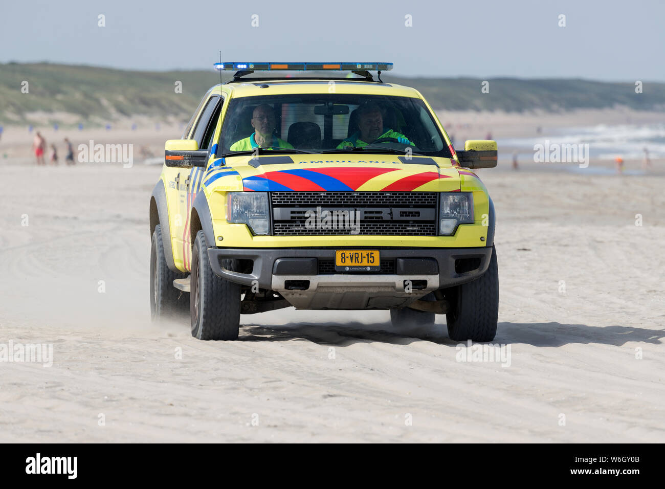 Dutch ambulance Ford F-150 with active blue emergency lighting on the beach Stock Photo