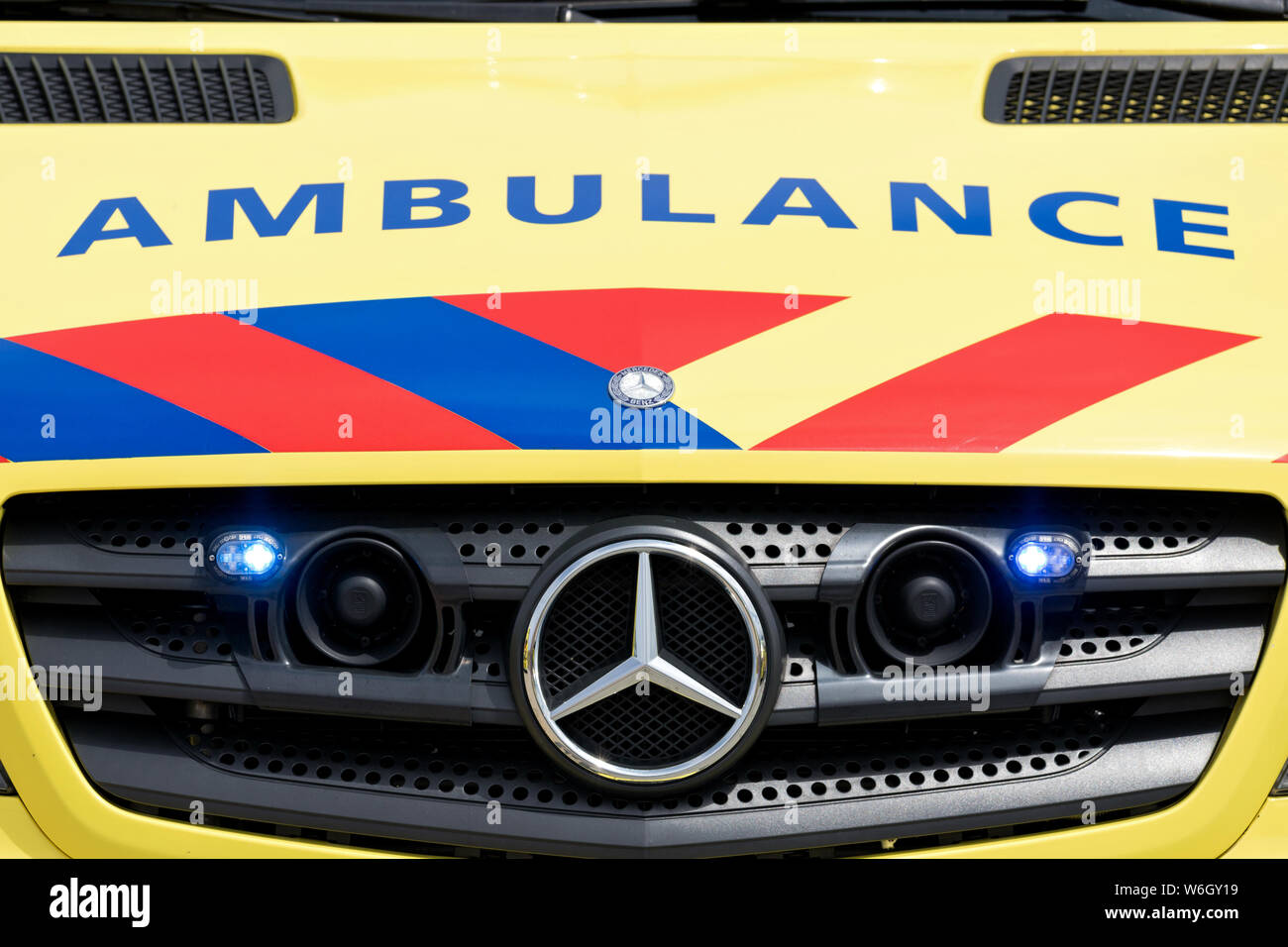 Dutch ambulance Mercedes-Benz Sprinter with active blue emergency lighting Stock Photo