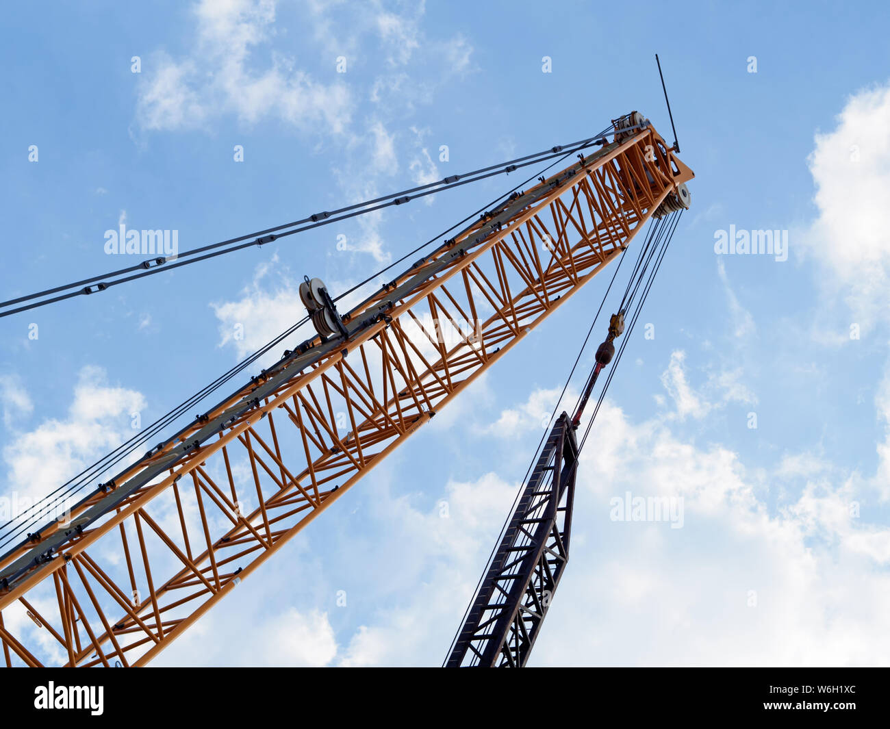 Liebherr LR 1250 250 ton Crawler Crane boom against blue sky with clouds. This crane being used in the New Corpus Christi Harbor Bridge project 2019. Stock Photo