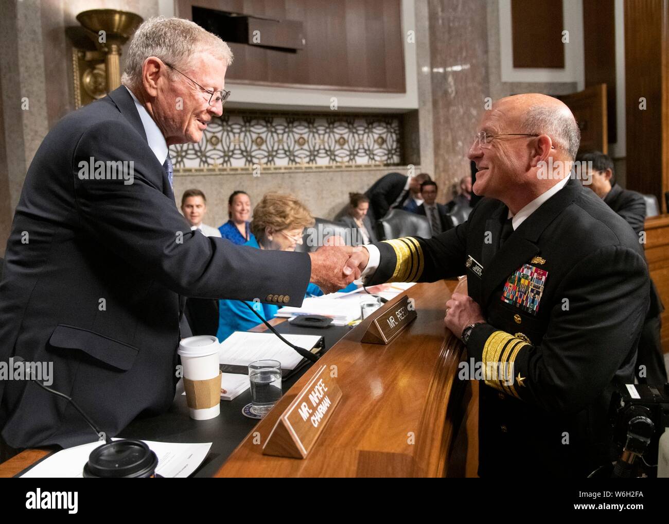 U.S. Navy Vice Adm. Michael M. Gilday, director of the Joint Staff, right, greets Sen. James Inhofe before the start of his confirmation hearing for the position of Chief Naval Operations, at the Senate Armed Services Committee in the Senate Dirksen Building July 31, 2019 in Washington, D.C. Stock Photo