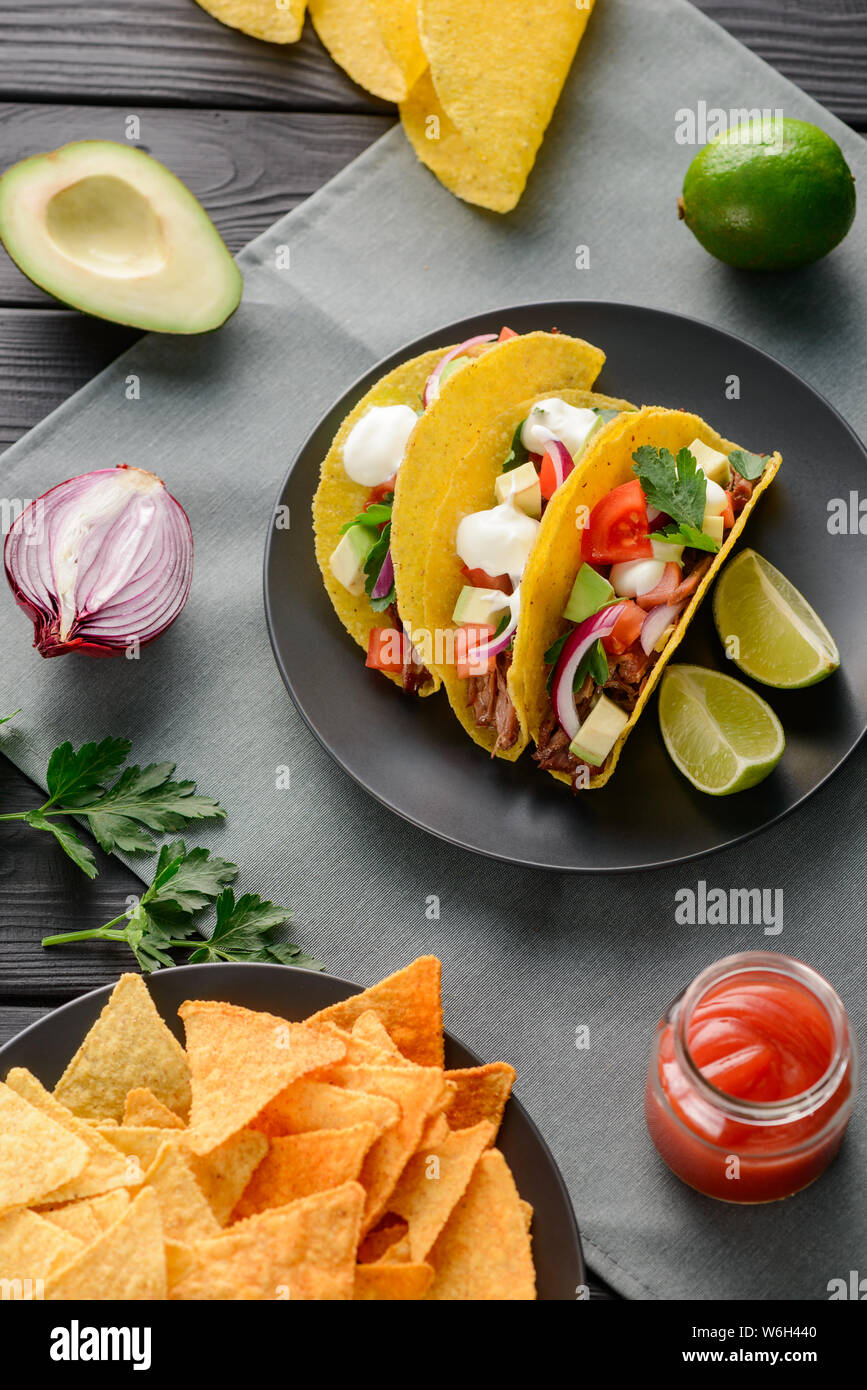 Hardshell tacos and ingredients Stock Photo Alamy