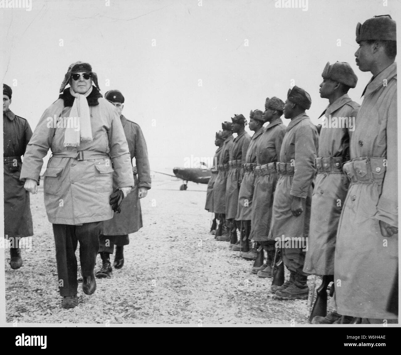 General of the Army Douglas MacArthur is shown inspecting troops of the 24th Infantry on his arrival at Kimpo airfield for a tour of the battlefront. International News Photos.; General notes:  Use War and Conflict Number 1375 when ordering a reproduction or requesting information about this image. Stock Photo