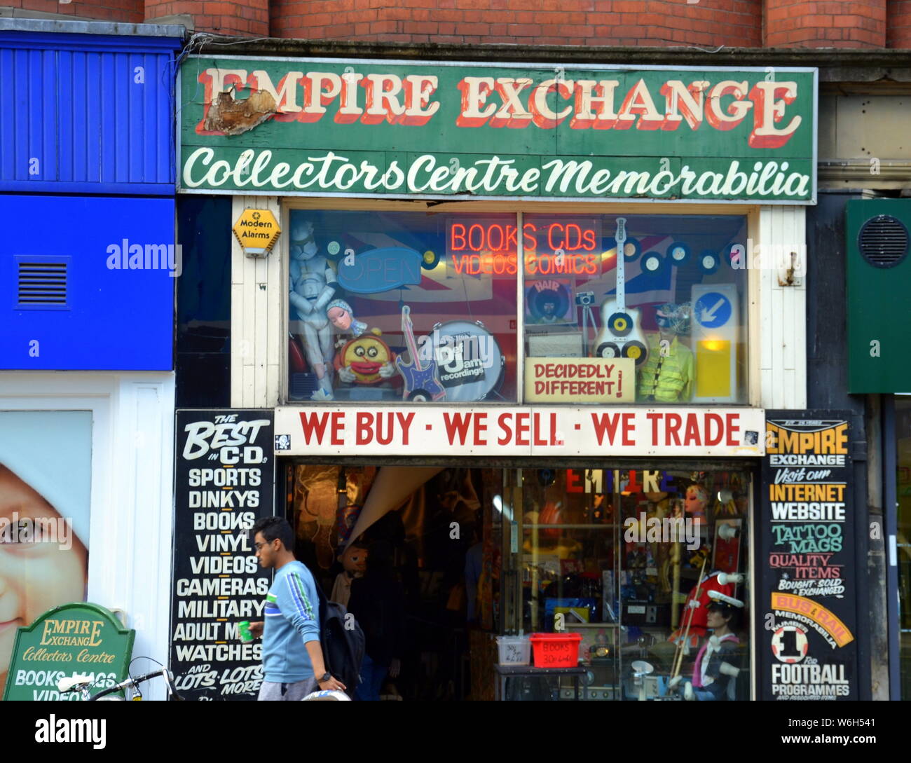 View of the facade of the Empire Exchange shop on Newton Street, city centre Manchester, uk. The shop buys and sells collectibles, customers can trade Stock Photo