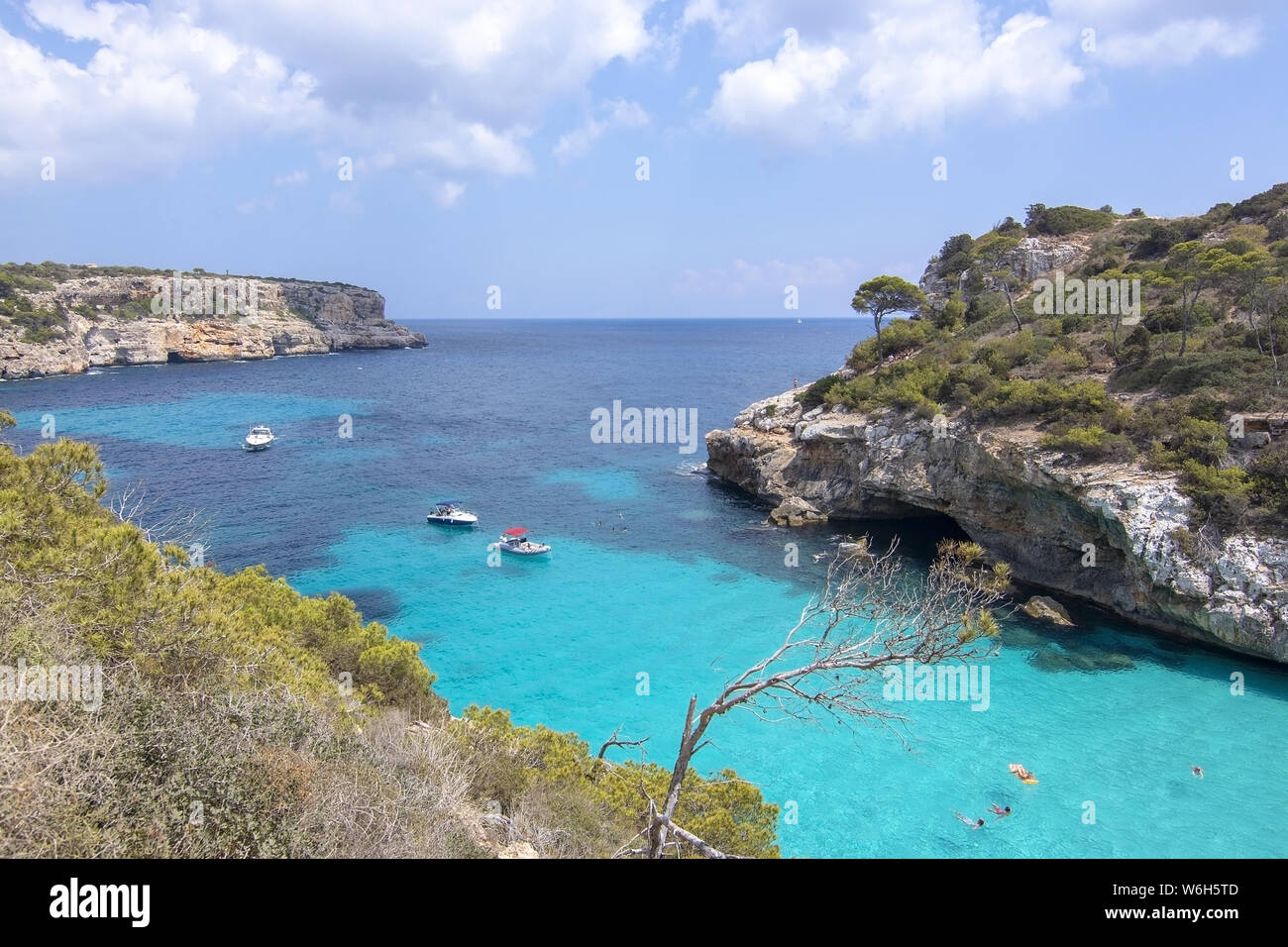 CALO DES MORO, MALLORCA, SPAIN - JULY 27, 2019: Small extremely turquoise bay and steep cliffs on a sunny day on July 27, 2019 in Calo des Moro, Mallo Stock Photo