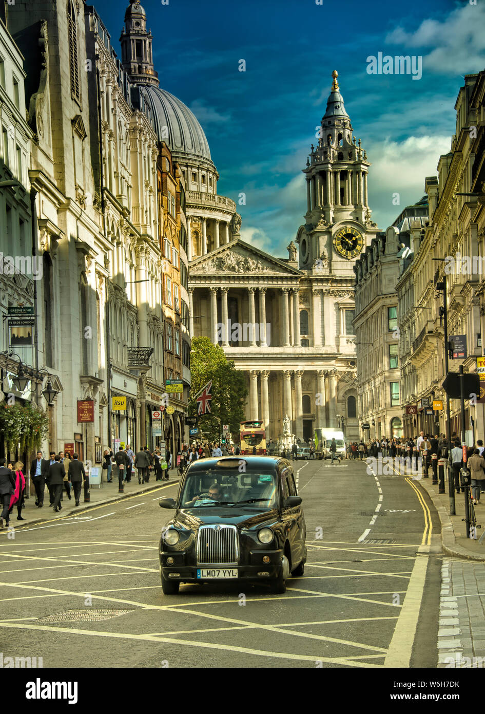 one of london iconic transportation, black taxi near st paul's cathedral during evening Stock Photo