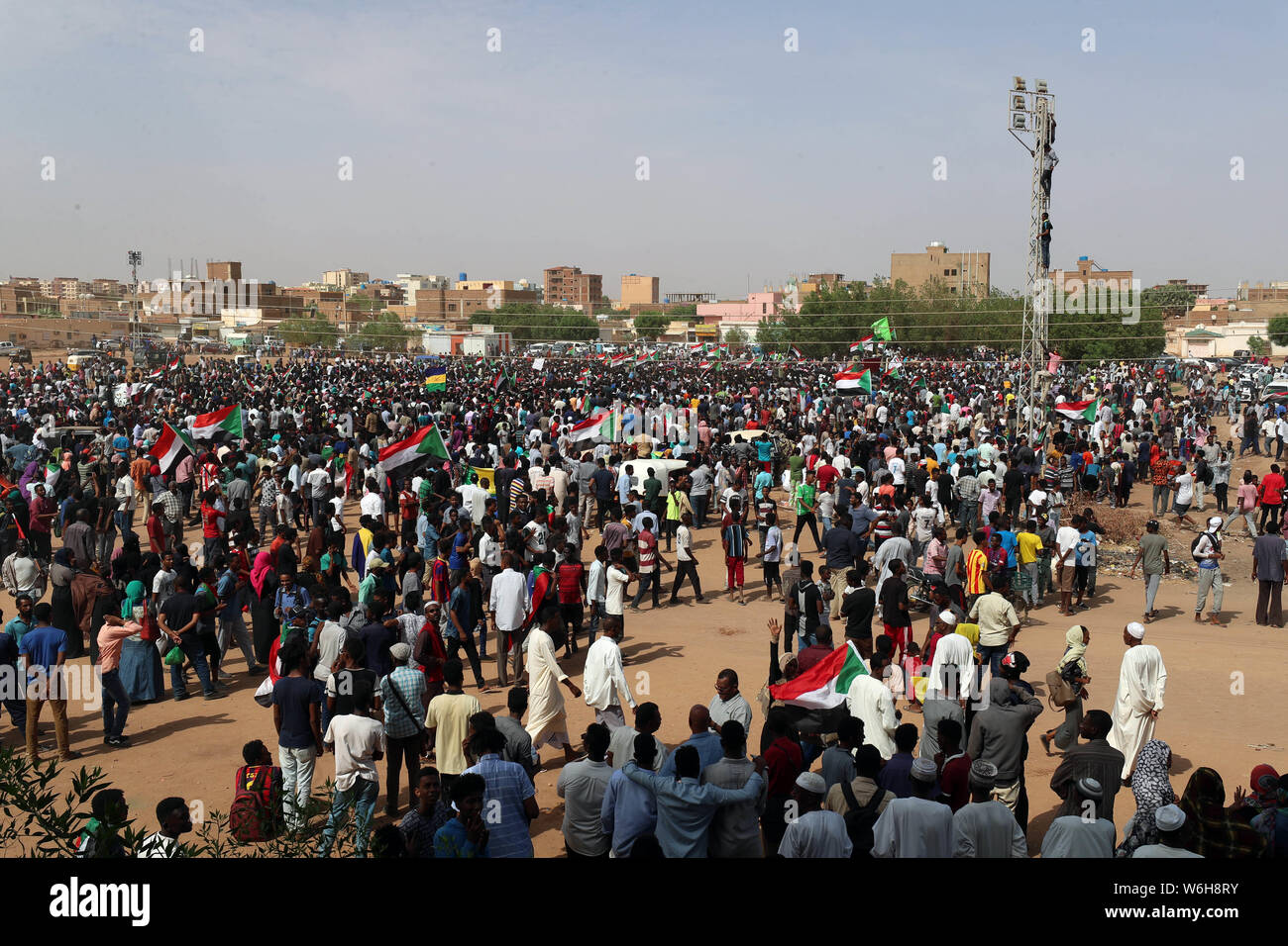 (190801) -- KHARTOUM, Aug. 1, 2019 (Xinhua) -- Sudanese people take part in a demonstration in Khartoum, Sudan, on Aug. 1, 2019. Five people were killed and dozens of others injured during a shooting attack in El Obeid city on July 29. The incident sparked a wave of anger and widespread protests across Sudanese cities. (Photo by Mohamed Khidir/Xinhua) Stock Photo